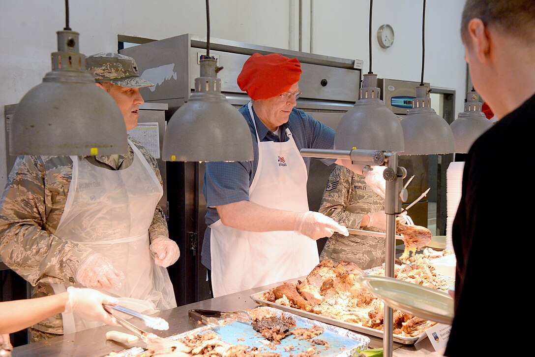 U.S. Deputy Defense Secretary Bob Work serves Thanksgiving dinner to service members on Al Udeid Air Base, Qatar, Nov. 26, 2015. DoD photo by Army Sgt. 1st Class Clydell Kinchen