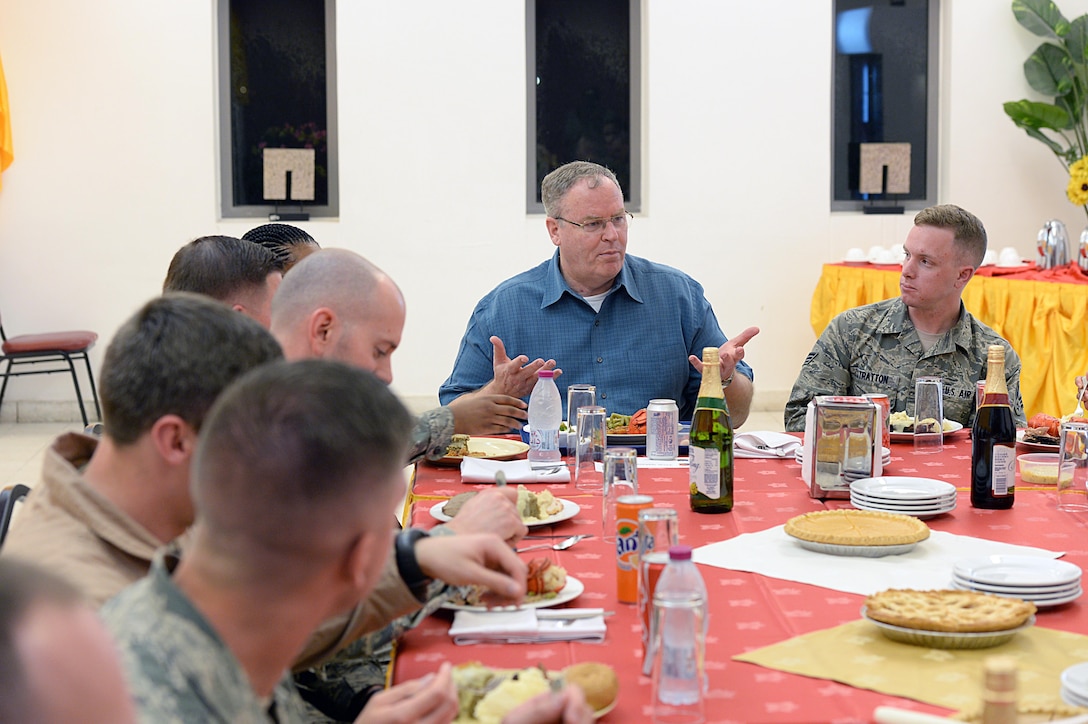 U.S. Deputy Defense Secretary Bob Work, center, talks with service members while having a Thanksgiving meal on Al Udeid Air Base, Qatar, Nov. 26, 2015. DoD photo by Army Sgt. 1st Class Clydell Kinchen