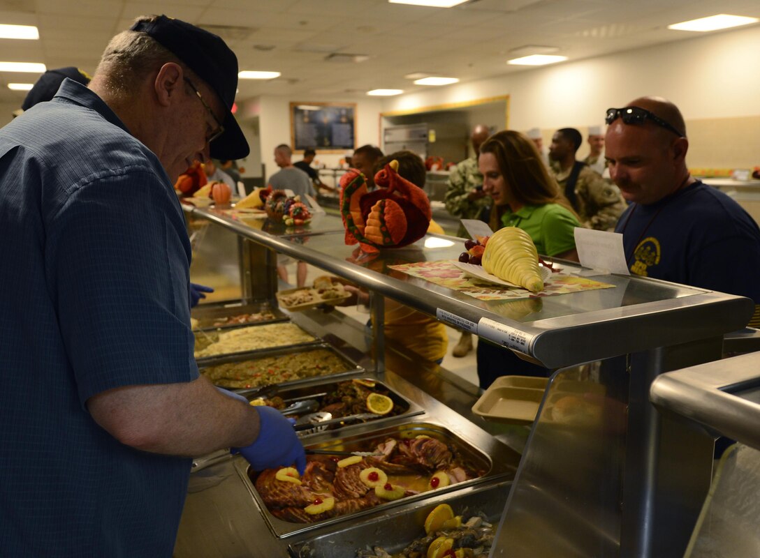 U.S. Deputy Defense Secretary Bob Work serves Thanksgiving lunch to service members on Camp Lemonnier, Djibouti, Nov. 26, 2015. U.S. Air Force photo by Senior Airman Peter Thompson