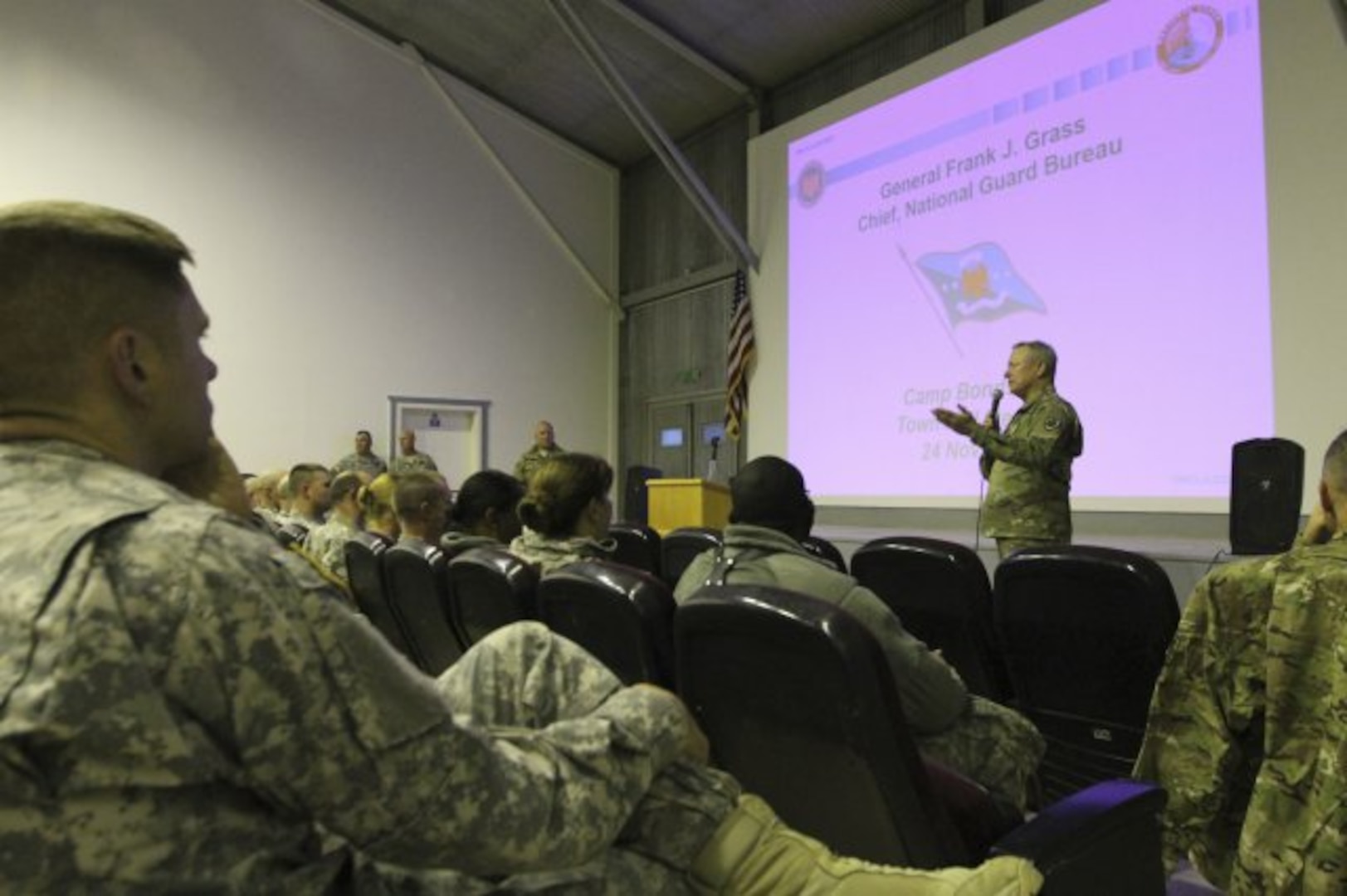 U.S. Army Gen. Frank J. Grass, chief of the National Guard Bureau, introduces himself to an audience of more than 200 reserve-component Service members during a town hall event at Camp Bondsteel, Kosovo, Nov. 24, 2015.