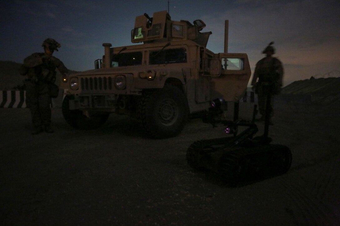 U.S. Marine explosive ordnance disposal technicians attached to Special Purpose Marine Air Ground Task Force-Crisis Response-Central Command, remotely operate a TALON Mark II robot to approach a simulated improvised explosive device in the vicinity of a forward operating base during a mission readiness exercise at an undisclosed location in Southwest Asia Nov. 24, 2015. The training exercise consisted of a scenario where a forward operating base in the area of responsibility required SPMAGTF-CR-CC reinforcement as part of its crisis response mission spanning 20 nations in the U.S. Central Command area of responsibility.  (U.S. Marine Corps Photo by Sgt. Rick Hurtado / Released)