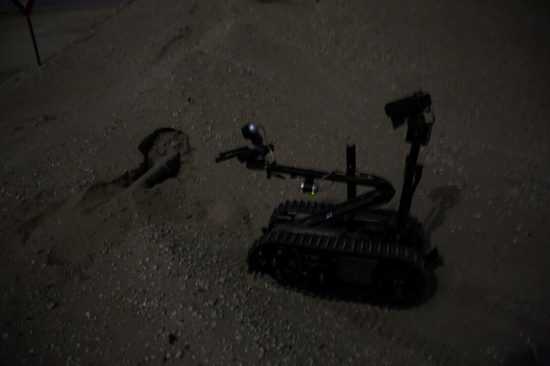 A TALON Mark II robot, operated by U.S. Marine explosive ordnance disposal technicians attached to Special Purpose Marine Air Ground Task Force-Crisis Response-Central Command, approaches a simulated improvised explosive device in the vicinity of a forward operating base during a mission readiness exercise at an undisclosed location in Southwest Asia Nov. 24, 2015. The training exercise consisted of a scenario where a forward operating base in the area of responsibility required SPMAGTF-CR-CC reinforcement as part of its crisis response mission spanning 20 nations in the U.S. Central Command area of responsibility.  (U.S. Marine Corps Photo by Sgt. Rick Hurtado / Released)