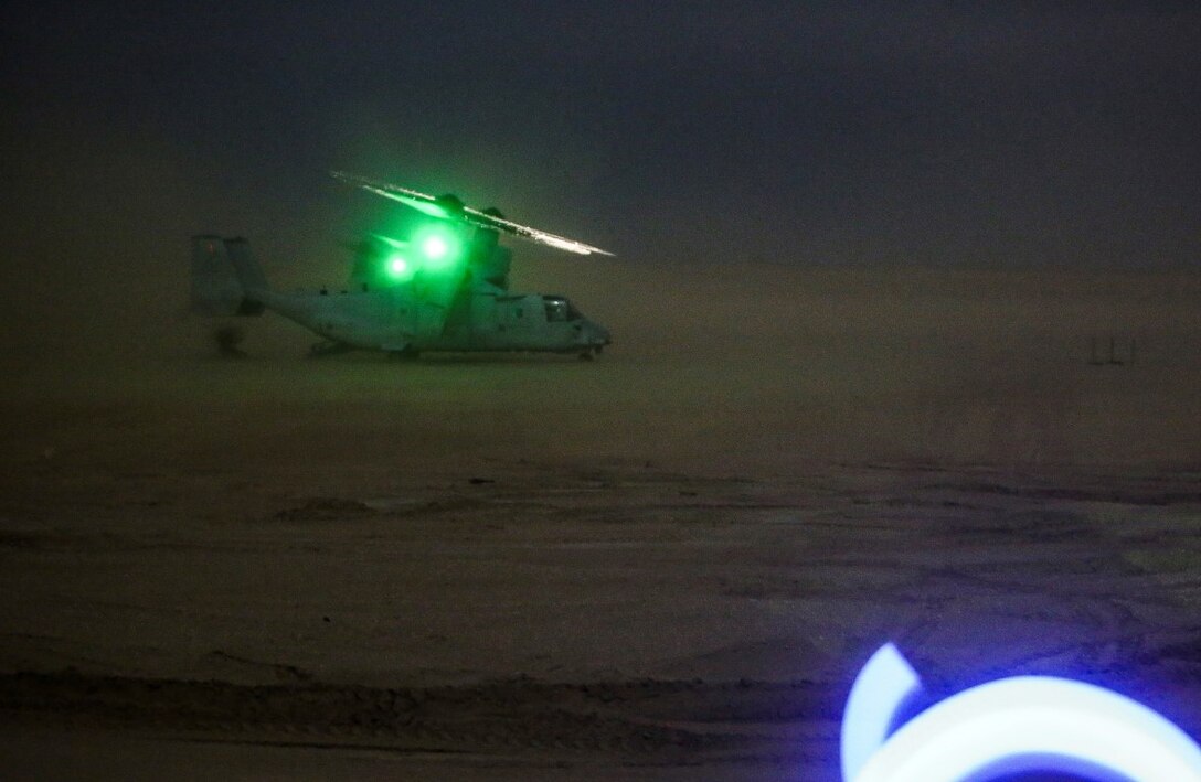 A U.S. Marine Corps MV-22 Osprey with U.S. Marines embarked from Company C, 1st Battalion, 7th Marine Regiment, Special Purpose Marine Air Ground Task Force-Crisis Response-Central Command, lands at an undisclosed location in Southwest Asia to insert the Marines into a training area during a mission readiness exercise Nov. 23, 2015.  The training exercise consisted of a scenario where a forward operating base in the area of responsibility required SPMAGTF-CR-CC reinforcement as part of its crisis response mission spanning 20 nations in the U.S. Central Command area of responsibility.  (U.S. Marine Corps Photo by Sgt. Rick Hurtado / Released)