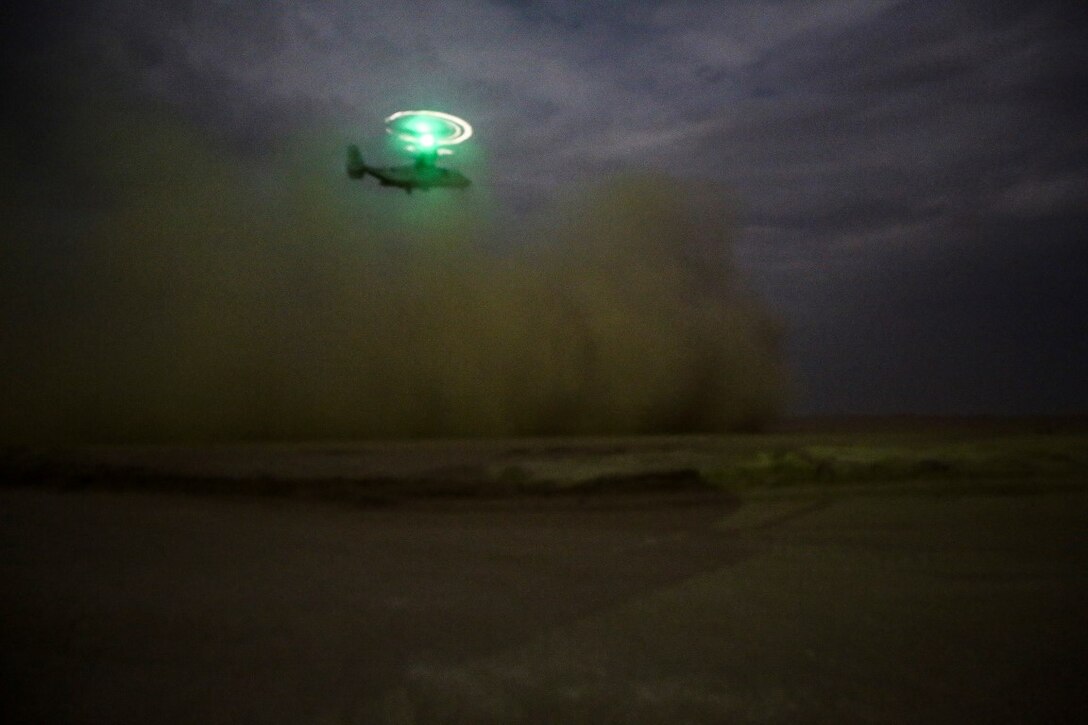 A U.S. Marine Corps MV-22 Osprey takes off after transporting U.S. Marines with Company C, 1st Battalion, 7th Marine Regiment, Special Purpose Marine Air Ground Task Force-Crisis Response-Central Command, at an undisclosed location in Southwest Asia during a mission readiness exercise Nov. 23, 2015.  The training exercise consisted of a scenario where a forward operating base in the area of responsibility required SPMAGTF-CR-CC reinforcement as part of its crisis response mission spanning 20 nations in the U.S. Central Command area of responsibility. (U.S. Marine Corps Photo by Sgt. Rick Hurtado / Released)