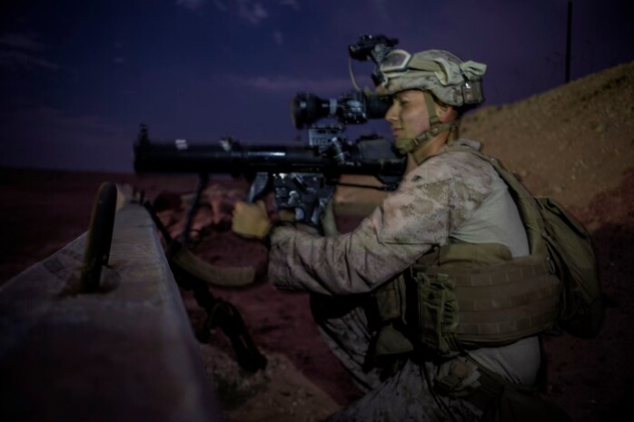 U.S. Marine Cpl. Christian Reyes, a shoulder-launched multipurpose assault weapon gunner with 1st Battalion, 7th Marine Regiment, Special Purpose Marine Air Ground Task Force-Crisis Response-Central Command, scans the surrounding environment for possible threats during a mission readiness exercise at an undisclosed location in Southwest Asia, Nov. 24, 2015. The Marines conducted the exercise to prepare for potential missions in the Central Command area of responsibility.  (U.S. Marine Corps Photo by Sgt. Owen Kimbrel / Released)