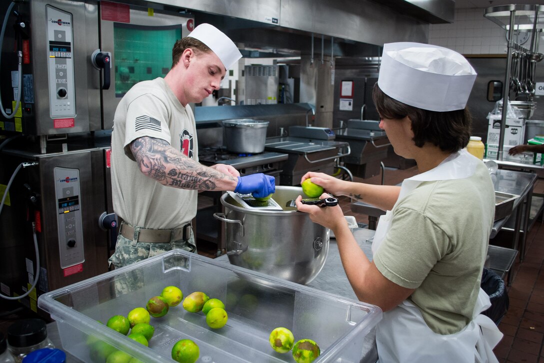 Green Berets grate lime peels as they and others prepare a Thanksgiving dinner in the unit’s dining facility on Eglin Air Force Base, Fla., Nov. 23, 2015. U.S. Army photo by Maj. Thomas Cieslak