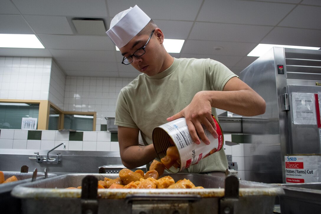 A Green Beret prepares sweet potatoes for baking as he and others prepare a Thanksgiving dinner in the unit’s dining facility on Eglin Air Force Base, Fla., Nov. 23, 2015. U.S. Army photo by Maj. Thomas Cieslak