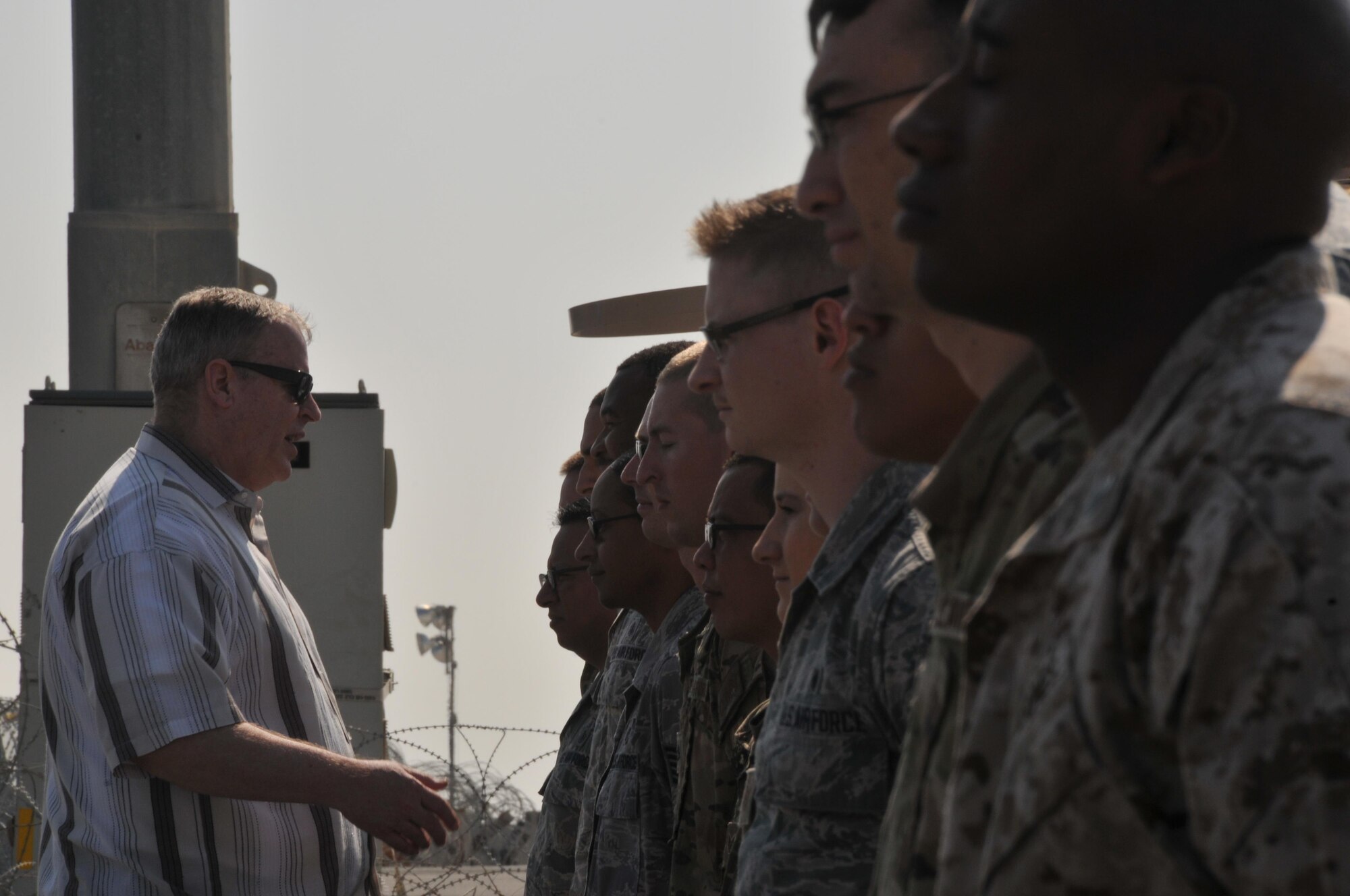 Deputy Secretary of Defense Bob Work coined hundreds of service members at Al Udeid Air Base, Qatar. Work visited service members on the flight line, at entry control points, and in the dining facilities. (U.S. Air Force Photo by Tech. Sgt. Terrica Y. Jones)