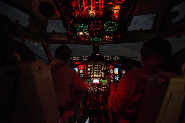 (Left) U.S. Air Force Capt. Mark Costa and Maj. Joseph Corpening fly a KC-135T Stratotanker, assigned to the 340th Expeditionary Air Refueling Squadron, over Southwest Asia, Nov. 23, 2015. Costa and Corpening are pilots deployed out of the 157th Air Refueling Wing in New Hampshire. Coalition forces fly daily missions in support of Operation Inherent Resolve.(U.S. Air Force photo by Staff Sgt. Corey Hook/Released)