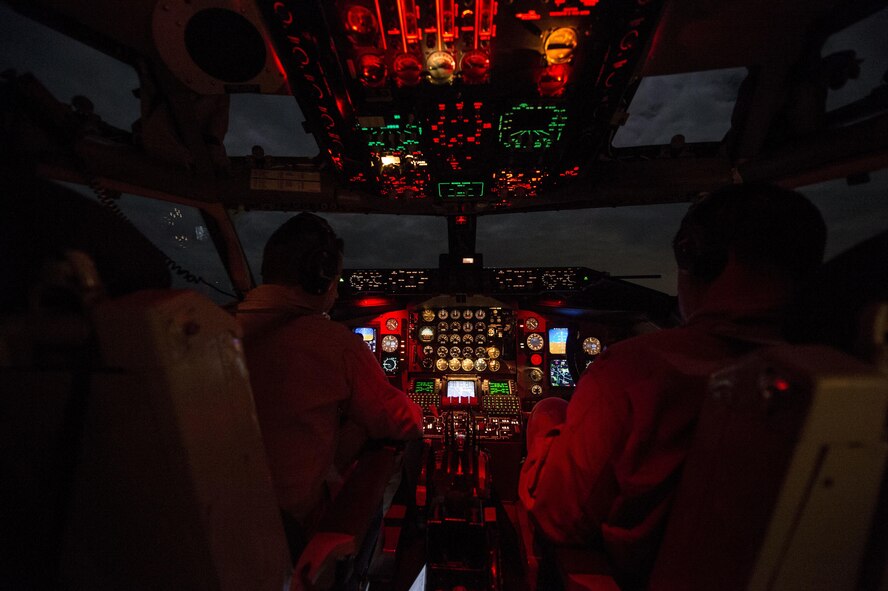 (Left) U.S. Air Force Capt. Mark Costa and Maj. Joseph Corpening fly a KC-135T Stratotanker, assigned to the 340th Expeditionary Air Refueling Squadron, over Southwest Asia, Nov. 23, 2015. Costa and Corpening are pilots deployed out of the 157th Air Refueling Wing in New Hampshire. Coalition forces fly daily missions in support of Operation Inherent Resolve.(U.S. Air Force photo by Staff Sgt. Corey Hook/Released)