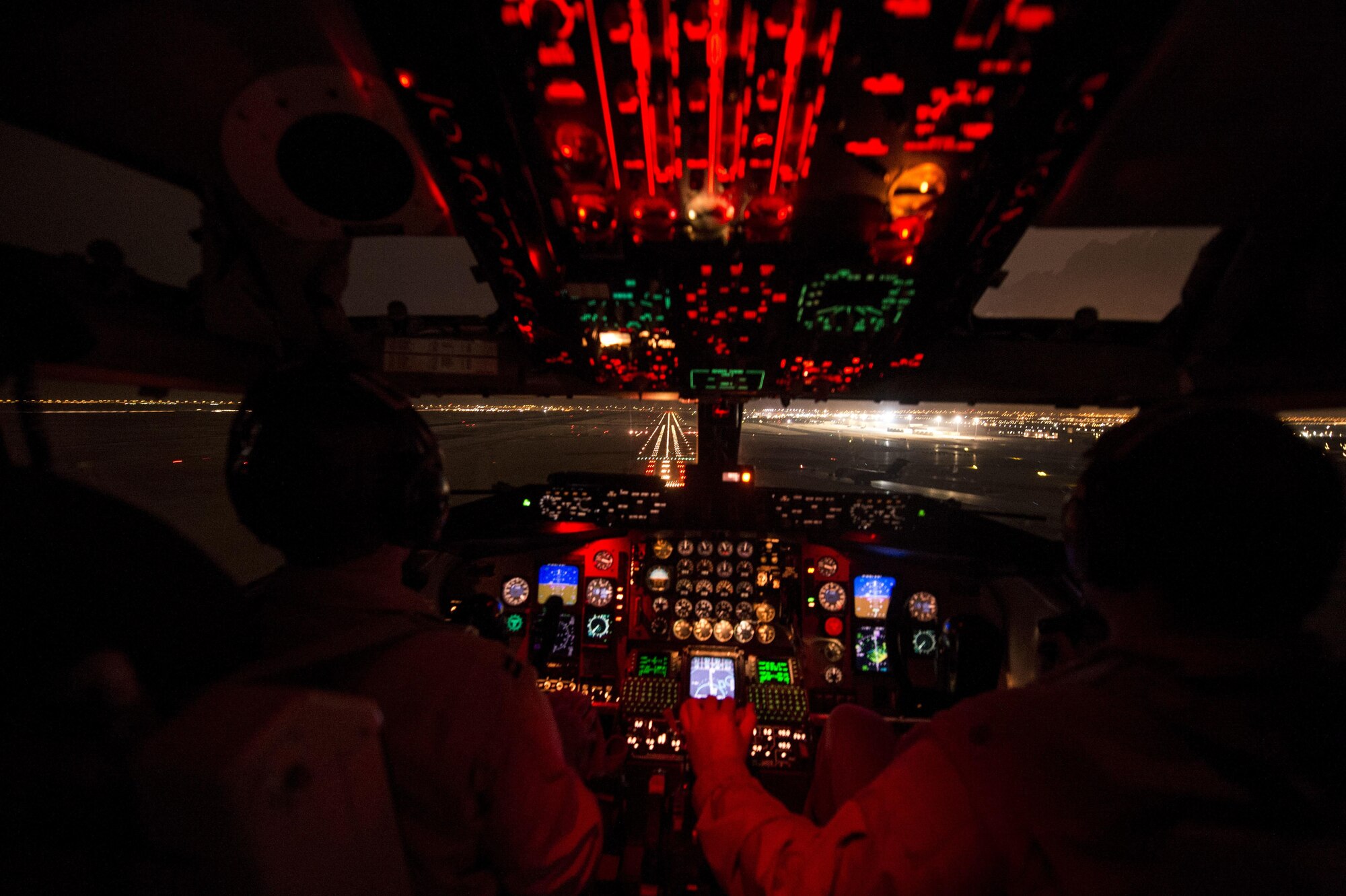 (Left) U.S. Air Force Capt. Mark Costa and Maj. Joseph Corpening land a KC-135T Stratotanker, assigned to the 340th Expeditionary Air Refueling Squadron, at Southwest Asia, Nov. 23, 2015. Costa and Corpening are pilots deployed out of the 157th Air Refueling Wing in New Hampshire. Coalition forces fly daily missions in support of Operation Inherent Resolve.(U.S. Air Force photo by Staff Sgt. Corey Hook/Released)