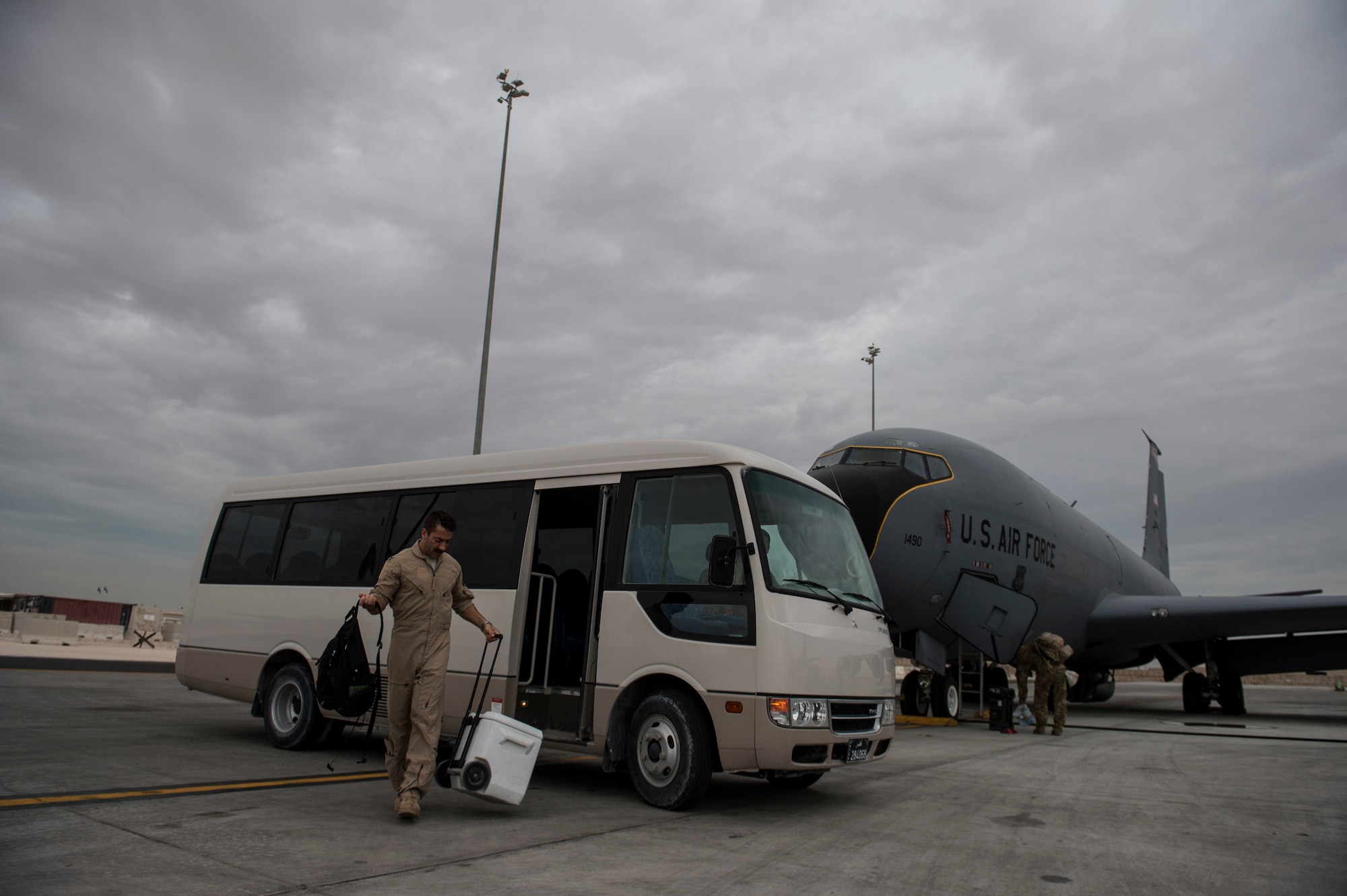 U.S. Air Force Capt. Mark Costa exits the bus he took to a KC-135T Stratotanker at Southwest Asia, Nov. 23, 2015. Costa is a pilot assigned to the 340th Expeditionary Air Refueling Squadron. (U.S. Air Force photo by Staff Sgt. Corey Hook/Released)