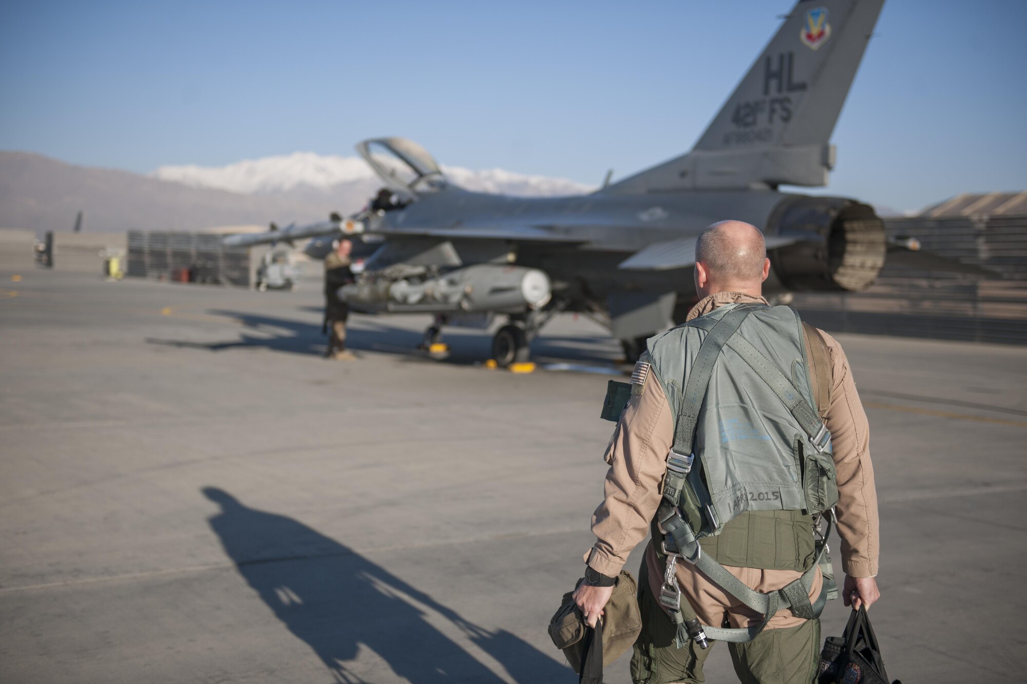 Col. Henry Rogers, 455th Expeditionary Operations Group commander, walks to his F-16 for a sortie with the 421st Expeditionary Fighter Squadron at Bagram Airfield, Afghanistan, Nov. 27, 2015. Rogers reached the 3,000-flying hour milestone and 1,000 combat-hour milestone while serving on his eighth combat deployment flying F-16s. (U.S. Air Force photo by Tech. Sgt. Robert Cloys/Released)
