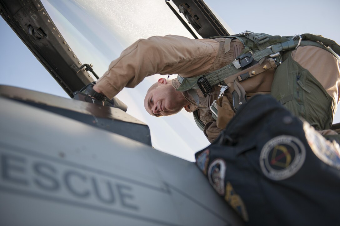 Col. Henry Rogers, 455th Expeditionary Operations Group commander, climbs in to an F-16 Fighting Falcon prior to a sortie with the 421st Expeditionary Fighter Squadron at Bagram Airfield, Afghanistan, Nov. 27, 2015. Rogers reached the 3,000-flying hour milestone and 1,000 combat-hour milestone while serving on his eighth combat deployment flying F-16s. (U.S. Air Force photo by Tech. Sgt. Robert Cloys/Released)