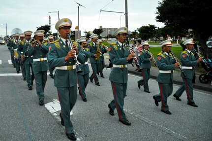 CAMP KINSER, OKINAWA, Japan – The Japan Ground Self-Defense Force marches in a parade during the Camp Kinser Christmas Tree Lighting Ceremony Nov. 27 aboard Camp Kinser, Okinawa, Japan. Hundreds of participants from all units on Kinser and children from various organizations such as Boy Scouts and Girl Scouts of America participated in the event.(Courtesy Photo by Toshi Nakamoto) 