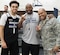 Capt. William-Joseph Mojica, 934th Airlift Wing Public Affairs, poses with Timberwolves Point Guard Tyus Jones and Assistant Coach Sidney Love during the Timberwolves' military open practice Nov. 24. (Air Force Photo/Paul Zadach)