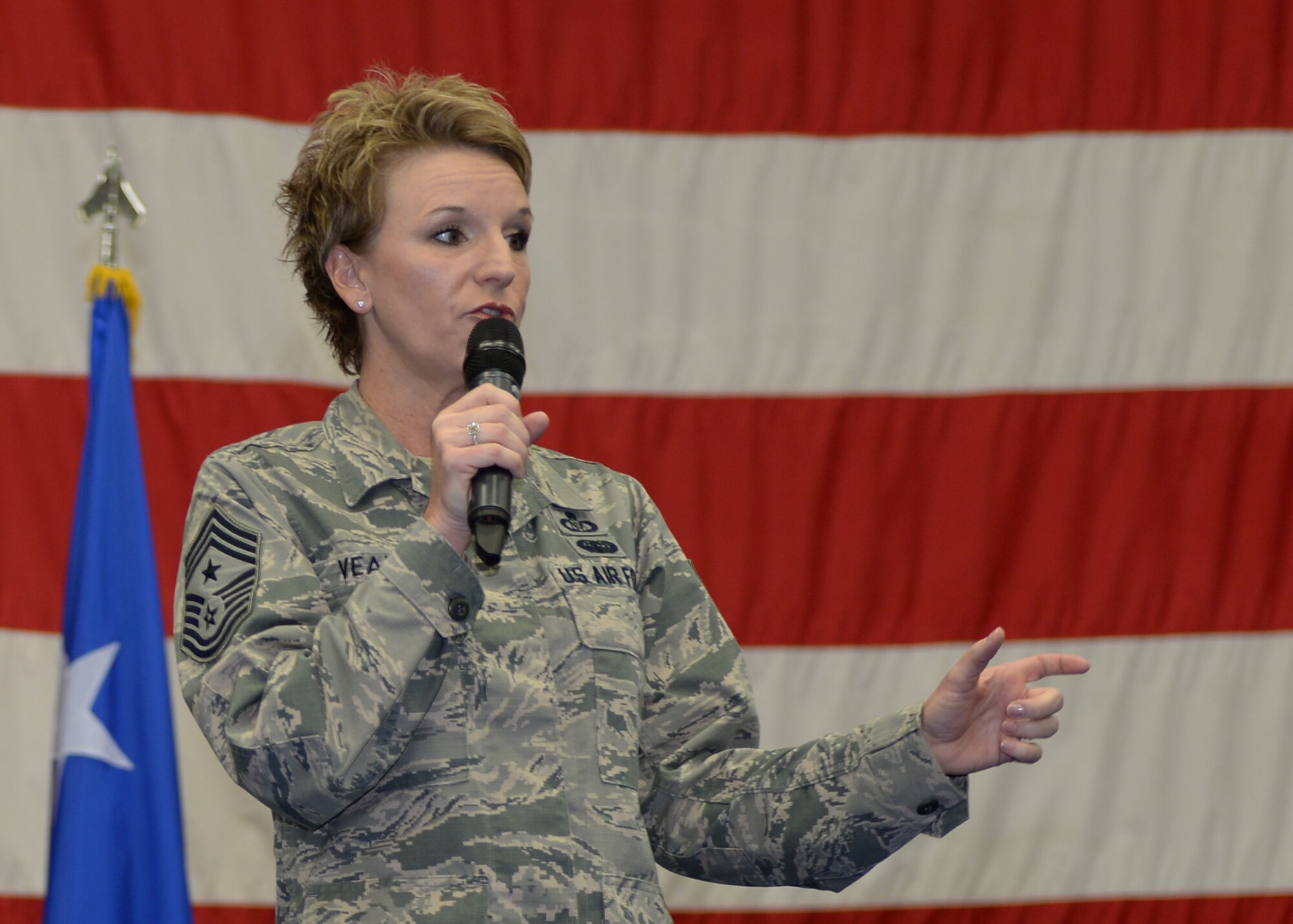 Chief Master Sgt. Gay Veale, 11th Air Force command chief, talks with Airmen during a base wide all call Nov. 24, 2015, at Andersen Air Force, Guam. Veale and 11th Air Force Commander Lt. Gen Russell Handy visited the base to interact with Airmen and leaders from Andersen AFB, Naval Base Guam, and Joint Region Marianas. (U.S. Air Force photo by Senior Airman Cierra Presentado/Released)
