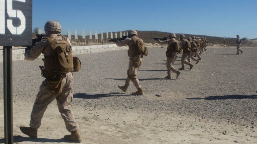Marines with I Marine Expeditionary Force move forward from the 15-yard line on a range during a close-quarters combat engagement qualification during Urban Leaders Course at Marine Corps Base Camp Pendleton, California, Oct. 26, 2015. If any of the Marines missed more than 18 rounds, they have one more chance to qualify.