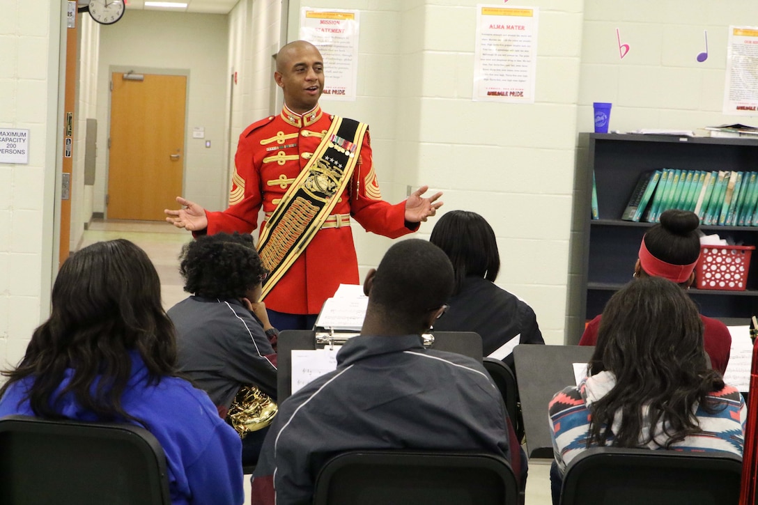 Master Gunnery Sergeant Kevin Buckles, Marine Corps Drum and Bugle Corps’ Senior Enlisted Advisor and Drum Major of “The Commandant’s Own,” speaks to the high school band of McDonogh 35 during his visit on Nov. 23, 2015. Master Gunnery Sergeant Buckles is a native of New Orleans and was also a high school graduate from McDonogh 35. (U.S. Marine Corps photo by Sgt. Rubin J. Tan/Released)