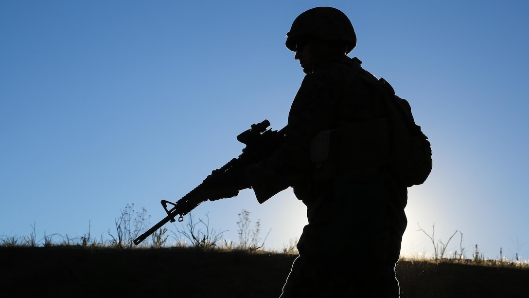 Lance Cpl. Alexander Sieck, a Greenville, Calif. and data network specialist with Combat Logistics Battalion 11, 1st Marine Logistics Group, remains vigilant on a patrol during the certification portion of the Basic Combat Skills Course aboard Marine Corps Base Camp Pendleton, Calif., Nov. 20, 2015. BCSC serves as a refamiliarization course for non-infantry Marines, teaching the fundamental skills needed to operate in a deployed environment.