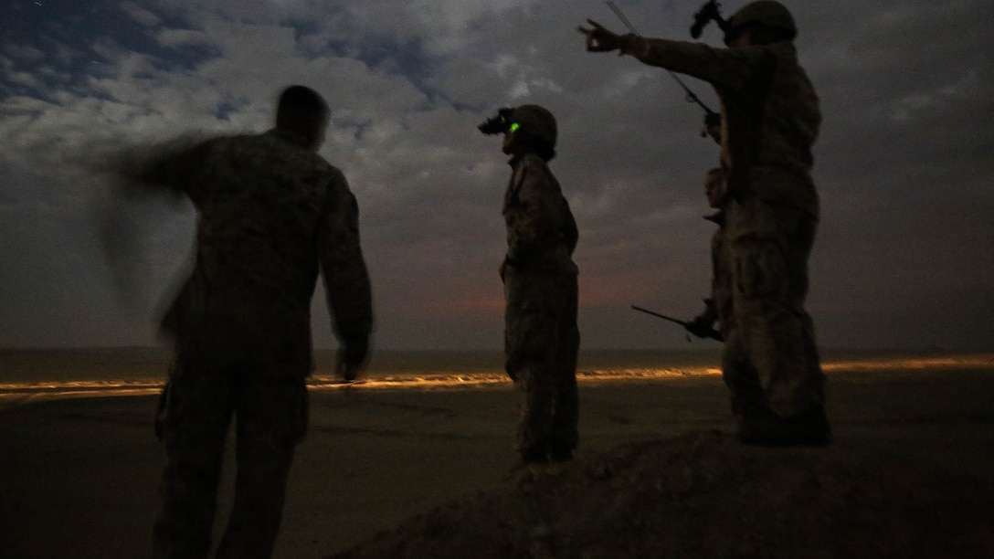 U.S. Marines with Combat Logistics Battalion 1, Special Purpose Marine Air Ground Task Force-Crisis Response-Central Command, coordinate an aerial delivery of supplies during a mission readiness exercise at an undisclosed location in Southwest Asia Nov. 24, 2015. The training exercise consisted of a scenario where a forward operating base in the area of responsibility required SPMAGTF-CR-CC reinforcement as part of its crisis response mission spanning 20 nations in the U.S. Central Command area of responsibility.  