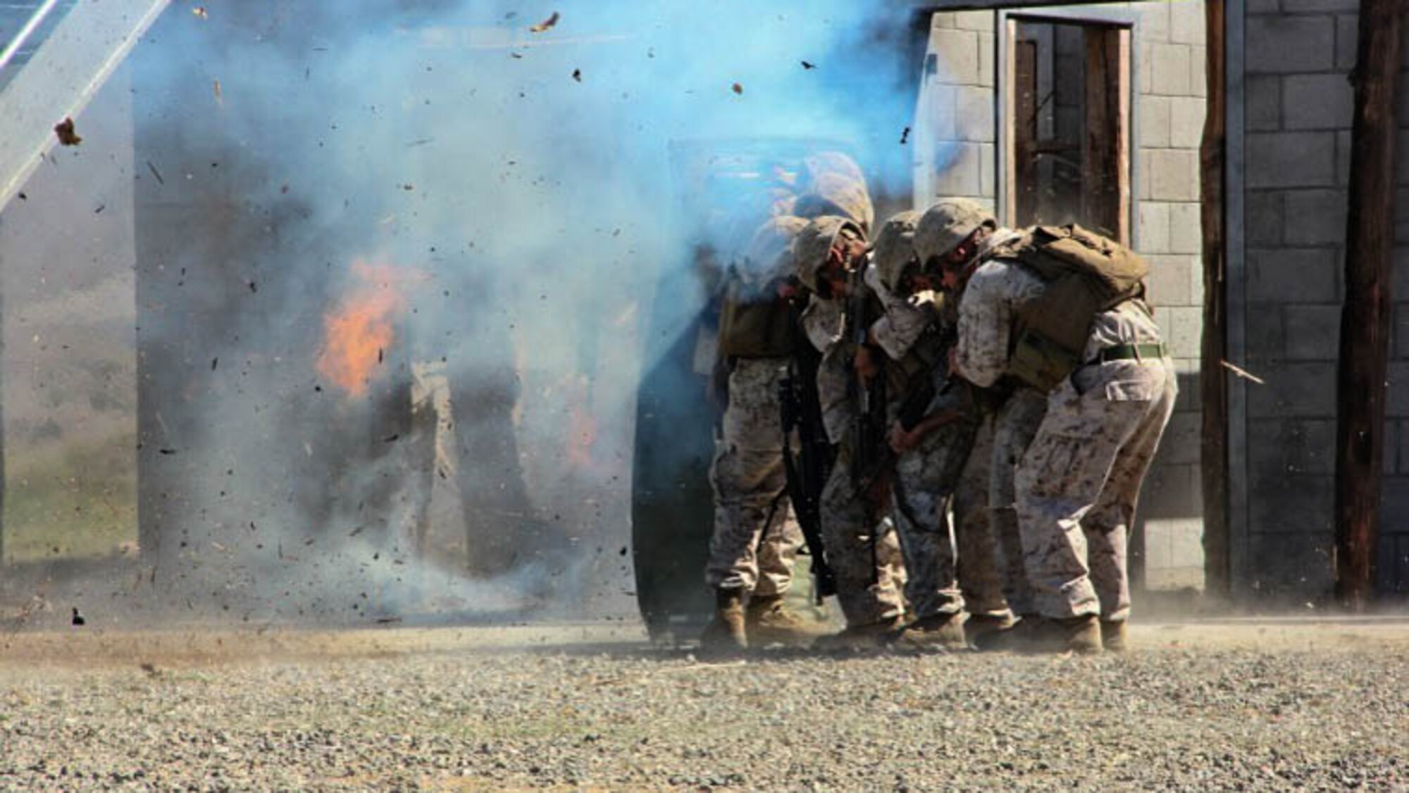 Lance Cpl. Taylor Drake, a combat engineer with 1st Combat Engineer Battalion, 1st Marine Division, breaches a door with an oval charge at Marine Corps Base Camp Pendleton, California, Drake, a Phoenix native, conducted breaching and room clearing drills with 2nd Platoon, Bravo Company, 1st CEB Marines, Oct. 8, 2015.