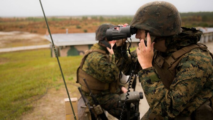 Cpl. Darion Binder,a fire supportman with 1st Battalion, 10th Marine Regiment radios in during a live-fire training event at Camp Lejeune, N.C., Nov. 19, 2015. The Marines conducted this training in order to test the new M1122 training round. 