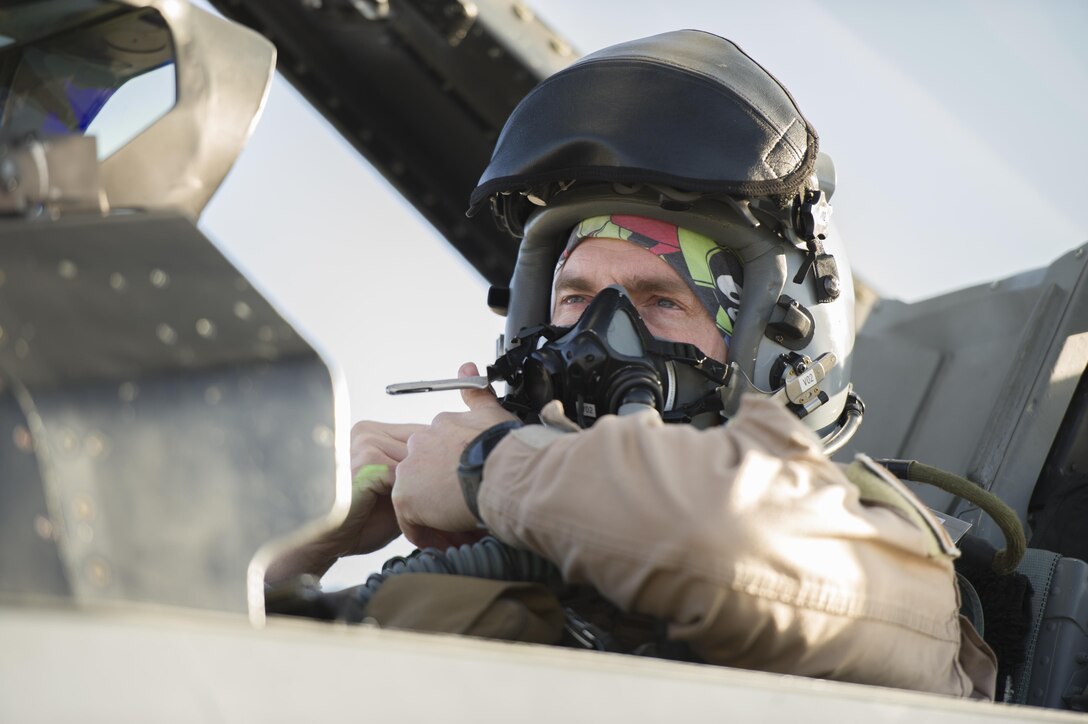 U.S. Air Force Col. Henry Rogers,  421st Expeditionary Fighter Squadron, puts on his helmet at Bagram Airfield, Afghanistan, Nov. 27, 2015. U.S. Air Force photo by Tech. Sgt. Robert Cloys