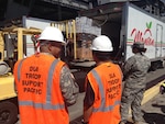 DLA Troop Support Pacific personnel oversee the delivery of fresh fruit and vegetables to the USS Theodore Roosevelt Nov. 15 at Joint Base Pearl Harbor Hickam, Hawaii. It was the first delivery through Troop Support Pacific’s new long-term FF&V contract.