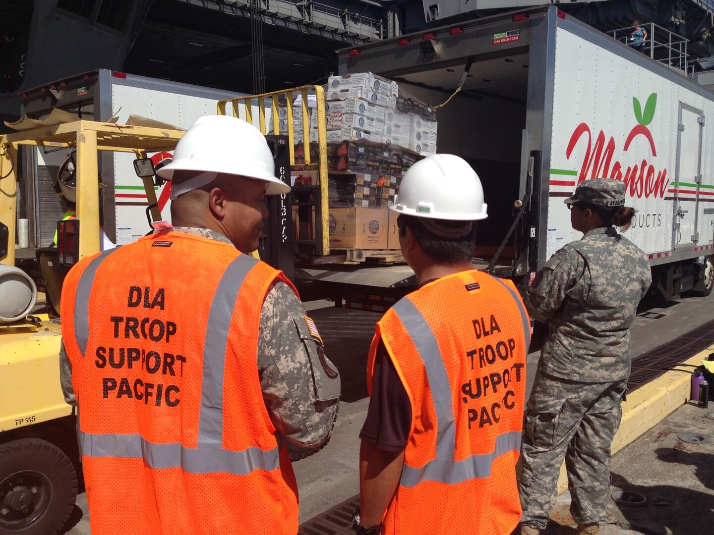 DLA Troop Support Pacific personnel oversee the delivery of fresh fruit and vegetables to the USS Theodore Roosevelt Nov. 15 at Joint Base Pearl Harbor Hickam, Hawaii. It was the first delivery through Troop Support Pacific’s new long-term FF&V contract.