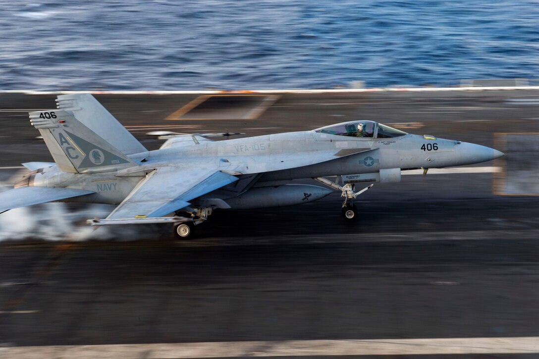 An F/A-18E Super Hornet assigned to the Gunslingers of Strike Fighter Squadron 105 makes an arrested landing on the flight deck of the aircraft carrier USS Dwight D. Eisenhower in the Atlantic Ocean, Nov. 27, 2015. The Dwight D. Eisenhower, with embarked Carrier Air Wing 3, is underway conducting the Tailored Ship's Training Availability and Final Evaluation Problem as part of the basic phase of the Optimized Fleet Response Plan. U.S. Navy photo by Seaman Anderson W. Branch
