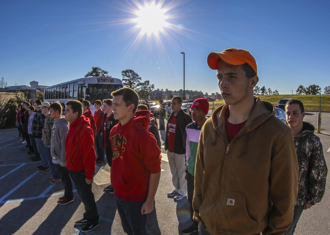 Cadets from the Navy Junior ROTC program at South Point High School in North Carolina stand at attention while waiting on a drill sergeant with the United States Army Drill Sergeant Academy to take them on a guided tour of the Academy grounds at Fort Jackson, S.C., Nov. 24, 2015. (U.S. Army photo by Sgt. 1st Class Brian Hamilton)