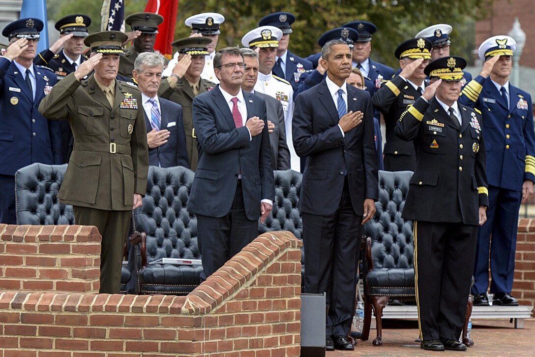 President Barack Obama, second from right, Defense Secretary Ash Carter, second from left, and Marine Gen. Joseph F. Dunford Jr, left, the incoming chairman of the Joint Chiefs of Staff, render honors during the change-of-responsibility ceremony between Dunford and Army Gen. Martin E. Dempsey, the outgoing chairman, on Joint Base Myer-Henderson Hall in Arlington, Va., Sept. 25, 2015. DoD photo by U.S. Army Sgt. 1st Class Clydell Kinchen