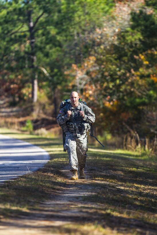 Army Capt. Jason Parsons marches toward the finish line of a 14-mile road march wearing a 55-pound ruckpack during the assessment phase of the Best Ranger Competition on Fort Jackson, S.C., Nov. 24, 2015. U.S. Army photo by Sgt. 1st Class Brian Hamilton