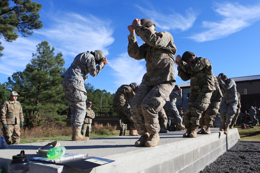 Soldiers practice their parachute landing falls before airborne operations on Fort Bragg, N.C., Nov. 25, 2015. The soldiers are paratroopers assigned to 112th Signal Battalion, 528th Special Operations Sustainment Brigade, which is conducting airborne operations to maintain proficiency in this task. U.S. Army photo by Sgt. 1st Class Sean A. Foley