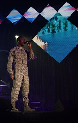 Senior Airman Rashaun Carter, U.S. Air Force Tops in Blue performer, solos during the group’s Nov. 28 performance at the Montana Expo Park in Great Falls, Mont. Promoting community relations, supporting recruiting efforts and serving as ambassadors for the United States and the U.S. Air Force is a critical component of the mission of Tops in Blue. (U.S. Air Force photo/Airman Collin Schmidt)