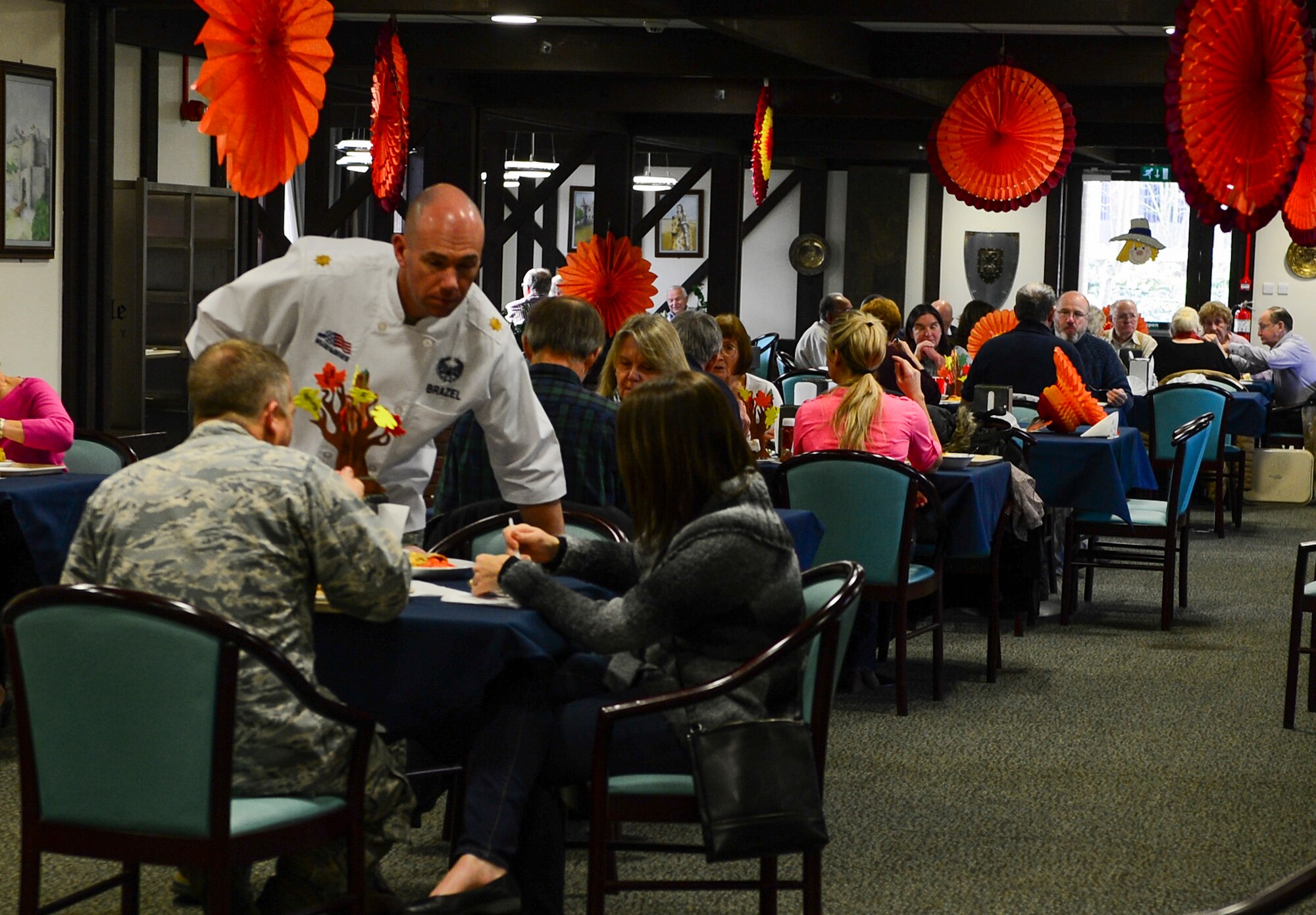 Liberty Airmen and their families enjoy Thanksgiving dinner with their larger Air Force family, Nov. 26, 2015 at the Knight's Table Dining Facility at Royal Air Force Lakenheath, England. The dinner had all the trimmings of a traditional Thanksgiving meal, right down to the pumpkin pie. (U.S. Air Force photo by Senior Airman Dawn M. Weber/Released)