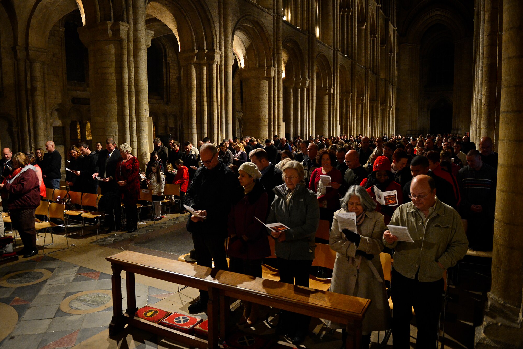 American service members, their families and other employees of Royal Air Forces Lakenheath, Feltwell and Mildenhall sing during a Thanksgiving Eve Service at Ely Cathedral in Ely, England, Nov. 25, 2015. The 29th Annual Thanksgiving Service gave U.S. service members in England an opportunity to enjoy an American holiday service within the British community. (U.S. Air Force photo by Airman 1st Class Erin R. Babis/Released)