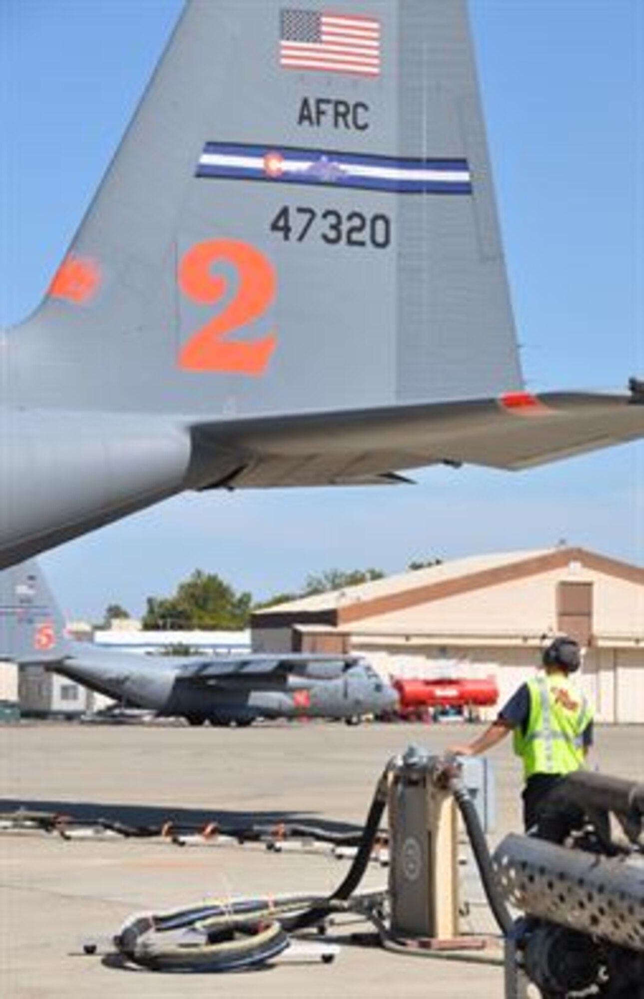 Two MAFFS-equipped C-130 aircraft from the Air Force Reserve Command’s 302nd Airlift Wing load up with retardant at McClellan Air Field Calif., Aug. 3, 2015. The aircraft began flying suppression missions on California fires within an hour of their initial arrival at the air field. The Colorado-based wing’s aircraft, crews and support personnel provided fire suppression support in California for one month. (U.S. Air Force photo/Master Sgt. Daniel Butterfield)