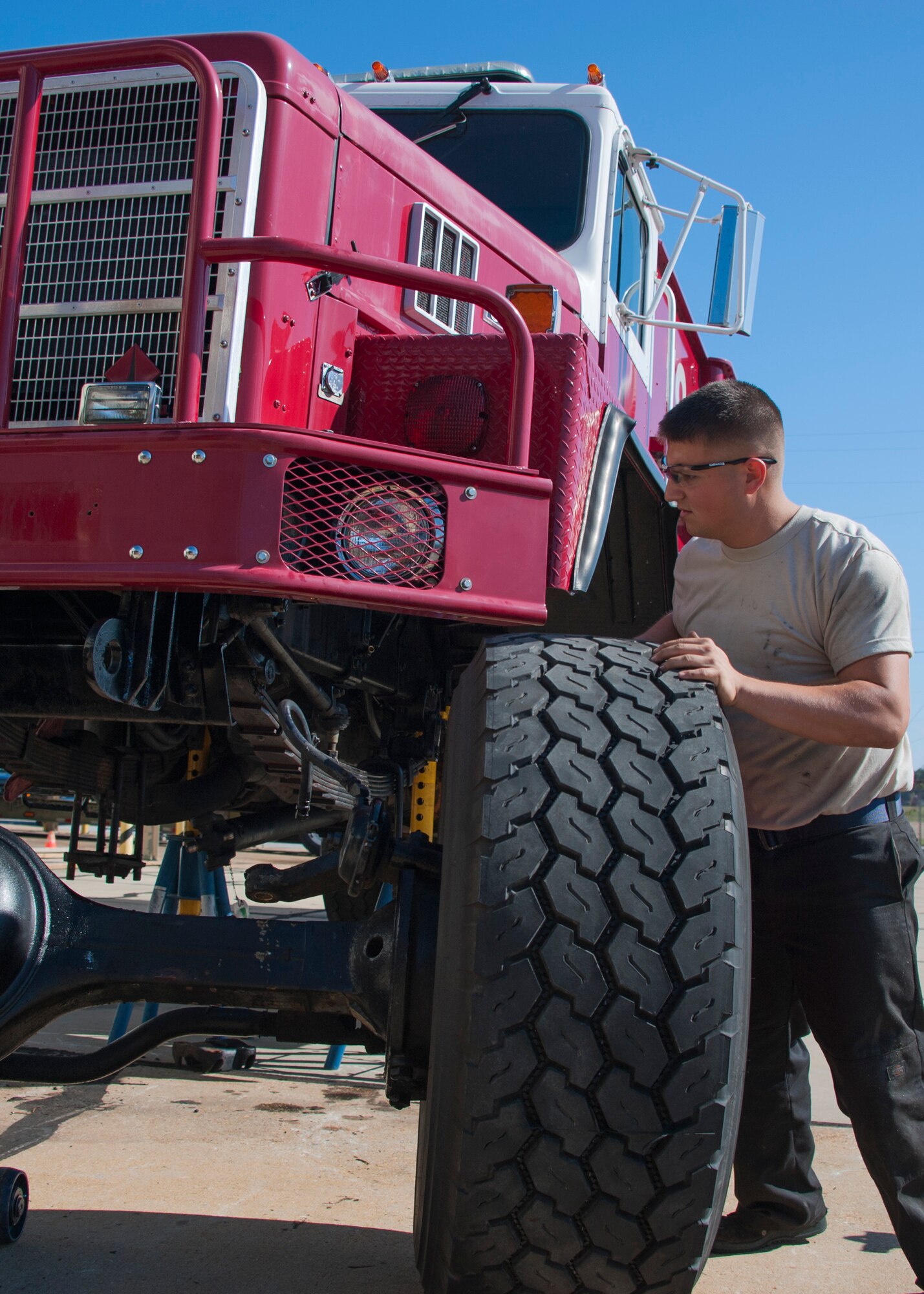 Airman 1st Class Thomas Zak, 96th Logistics Readiness Squadron, assists in the roll out of a 5,000 pound serviceable axle and differential assembly from a salvage fire truck Nov. 10 at Eglin Air Force Base, Fla. The part was procured from a Tyndall AFB fire truck slated for the salvage yard and re-installed into Tanker 46, a broken 1989 model 2,000 gallon water tanker fire truck. The repair job saved the wing $25 thousand and maintained response readiness. (U.S. Air Force photo/Ilka Cole)