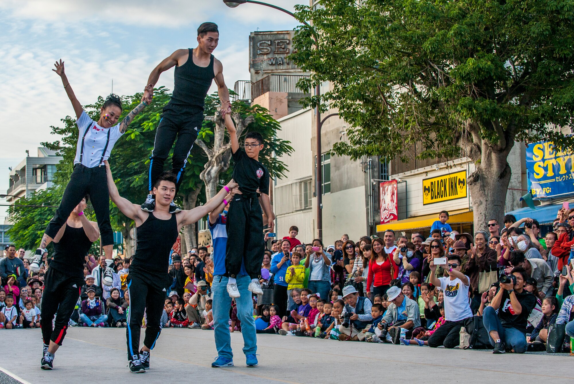 The Taiwan Team gymnastics group performs a stunt, with volunteers from the crowd, during the Okinawa City International Carnival Nov. 28, 2015, in Okinawa City, Japan. The Okinawa City International Carnival is held annually in honor of the friendship between Okinawa and Team Kadena. (U.S. Air Force photo by Airman 1st Class Nicholas Emerick)