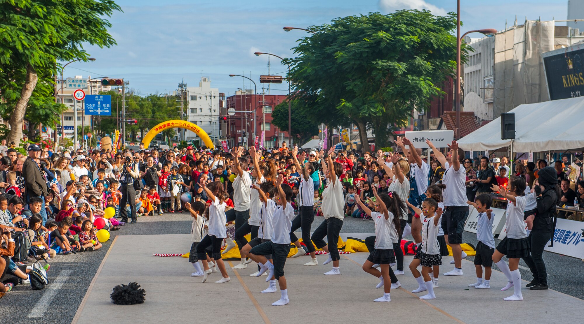 Members of Awase Rainbow perform a dance routine as part of the stage contest during the Okinawa City International Carnival Nov. 28, 2015, in Okinawa City, Japan. The Okinawa City International Carnival is an annual celebration of the friendship between Okinawa and Team Kadena. (U.S. Air Force photo by Airman 1st Class Nicholas Emerick)