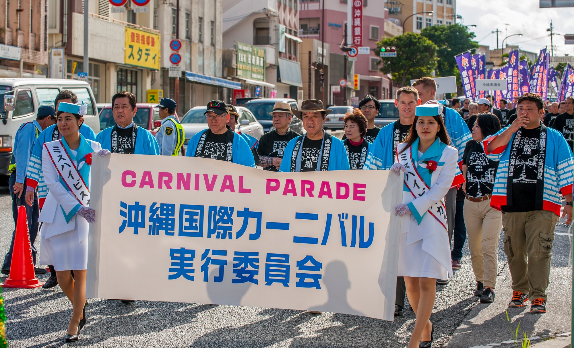 Okinawans and Americans march together during the Okinawa International Carnival parade Nov. 28, 2015, in Okinawa City, Japan. The annual carnival is an opportunity for Team Kadena and local Okinawans to celebrate ongoing friendships. (U.S. Air Force photo by Airman 1st Class Nicholas Emerick)