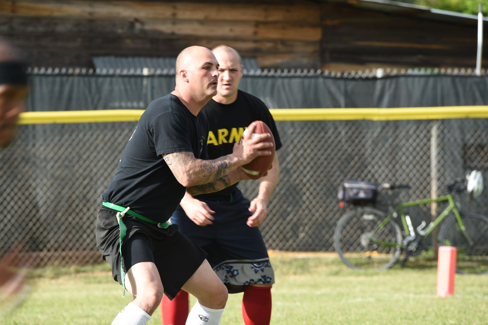 A U.S. Army member prepares to throw a football during the annual Turkey Bowl, Army vs. Air Force, at Soto Cano Air Base, Honduras, Nov. 25, 2015. (U.S. Air Force photo by Martin Chahin/Released)
