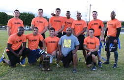 U.S. Air Force members pose for a celebration photo after winning the annual Turkey Bowl, Army vs. Air Force, at Soto Cano Air Base, Honduras, Nov. 25, 2015. (U.S. Air Force photo by Martin Chahin/Released)