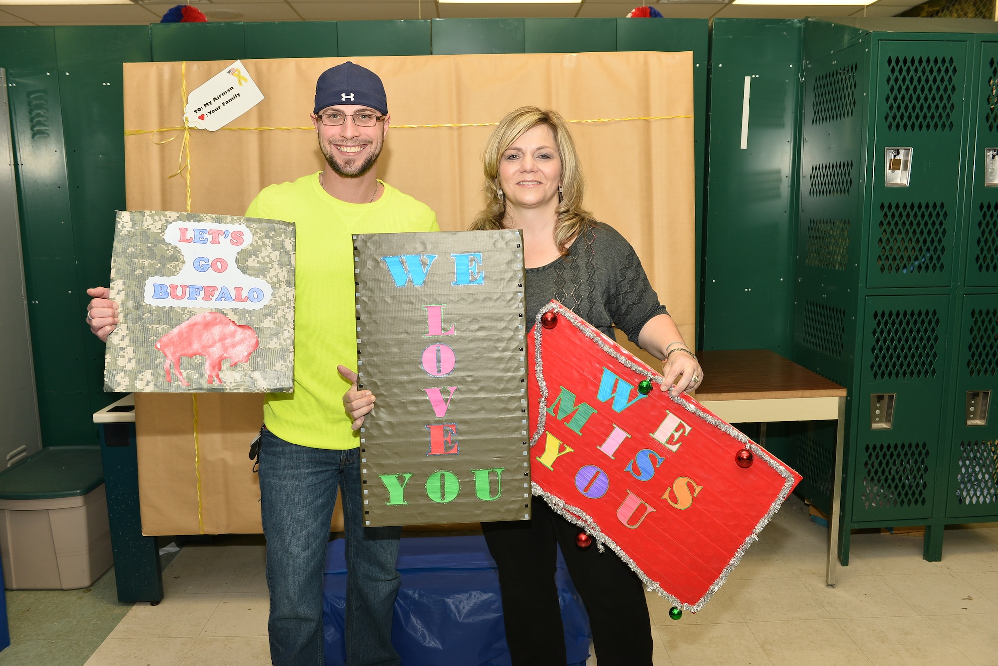 107th Airlift Wing family members prepared care packages for their loved ones who are deployed. Families pose for a photo to be included with their package. Nov. 7, 2012 (U.S. Air National Guard photo/Senior Master Sgt. Ray Lloyd)