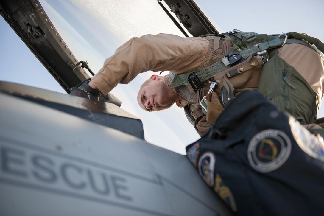 U.S. Air Force Col. Henry Rogers climbs into an F-16 Fighting Falcon aircraft on Bagram Airfield, Afghanistan, Nov. 27, 2015. Rogers, commander of the 455th Expeditionary Operations Group, reached the 3,000-flying hour and 1,000 combat-hour milestones earlier this fall during his eighth combat deployment flying F-16 aircraft. U.S. Air Force photo by Tech. Sgt. Robert Cloys