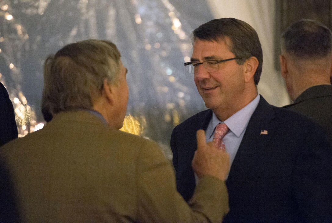 Defense Secretary Ash Carter speaks with a guest during the World Economic Forum dinner at the Pentagon, Sept. 30, 2015. DoD photo by Air Force Senior Master Sgt. Adrian Cadiz