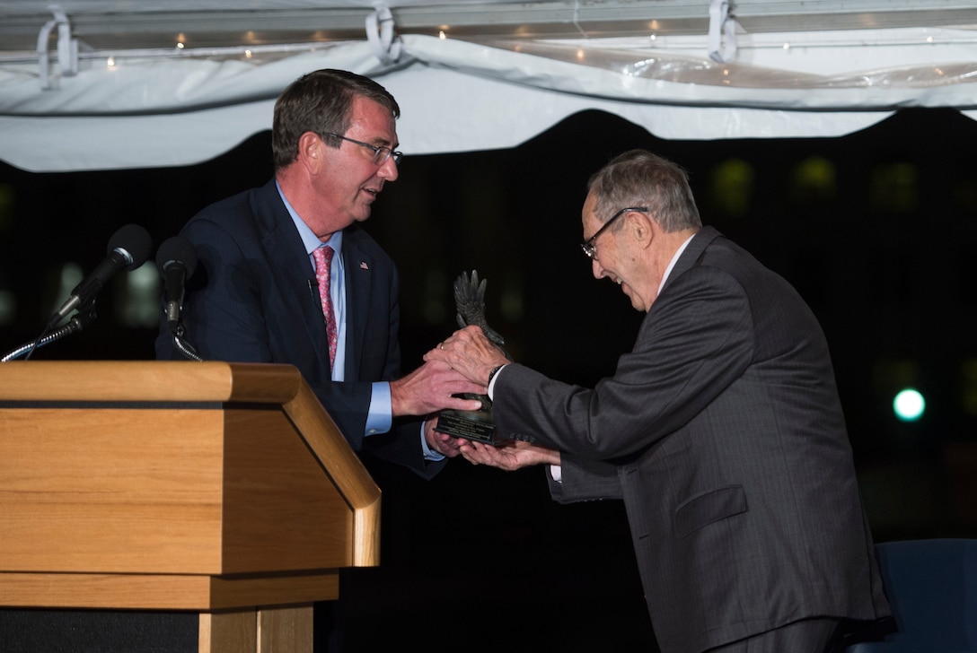 Defense Secretary Ash Carter presents the inaugural Innovators in Defense, Enterprise, Academia and Science award to former Defense Secretary William Perry during the World Economic Forum dinner at the Pentagon, Sept. 30, 2015. DoD photo by Air Force Senior Master Sgt. Adrian Cadiz