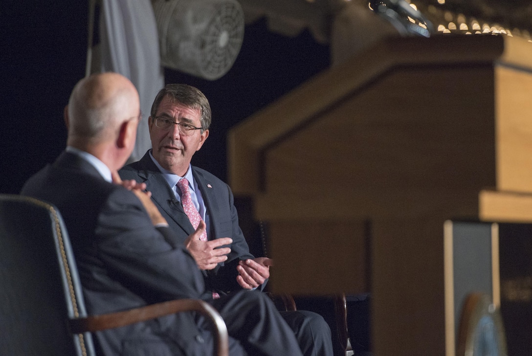 Secretary of Defense Ash Carter converses with Klaus Schwab, founder and executive chairman of the World Economic Forum, during the World Economic Forum dinner held at the Pentagon, Sept. 30, 2015. DoD photo by Air Force Senior Master Sgt. Adrian Cadiz